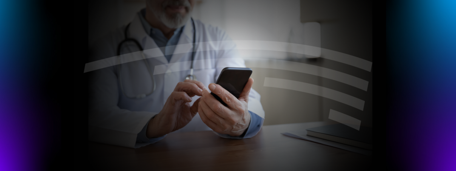 Senior professional male doctor holding mobile phone modern technology apps sitting at desk. Older physician using smartphone gadget tech for telemedicine remote online services concept. Close up view